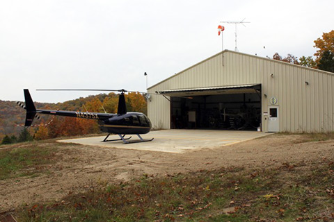 picture of R44 helicopter landing on helipad